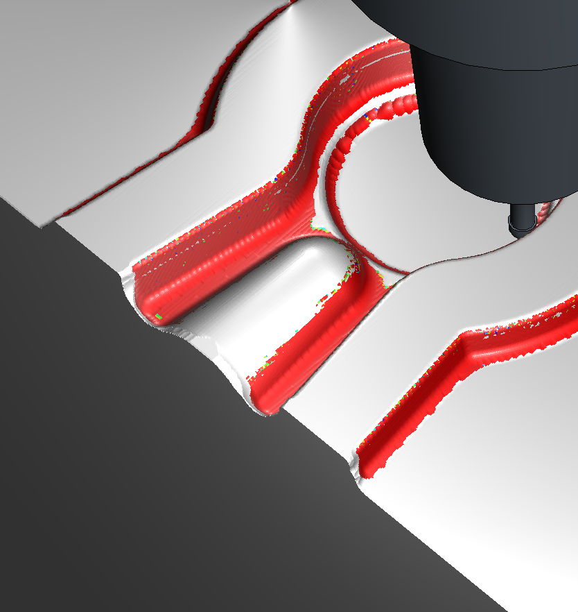 Closer view of the same paused pose: the Ø2.6 neck and ball tip below the chuck, red bands along the impression's R1.5 edges