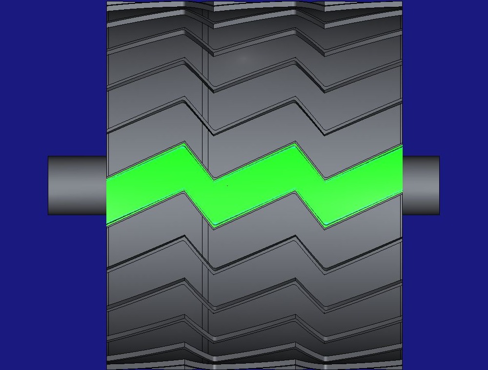 HiNC's comparison of the machined pitch with the design, seen from above: the whole chevron groove green on the grey tread