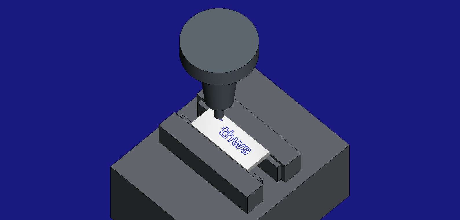 The keychain in HiNC: a shrink-fit holder with an 8 mm 90° chamfer mill engraving the logo on a plate held in a machine vise; the word thws is already engraved